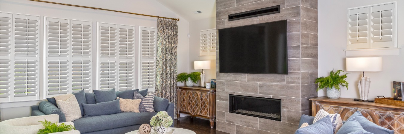 Plantation shutters in Lawrenceville family room with fireplace