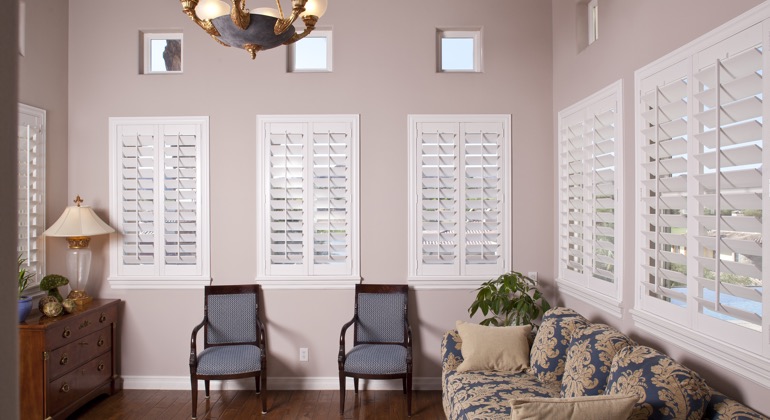 Modern parlor with white shutters