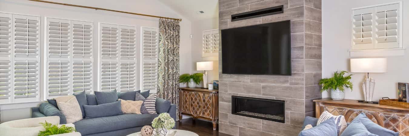Plantation shutters in Duluth family room with fireplace