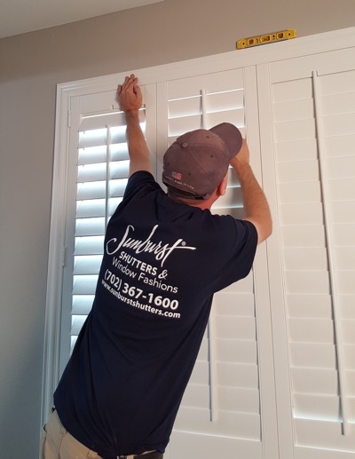 Shutter installation in Atlanta bedroom.