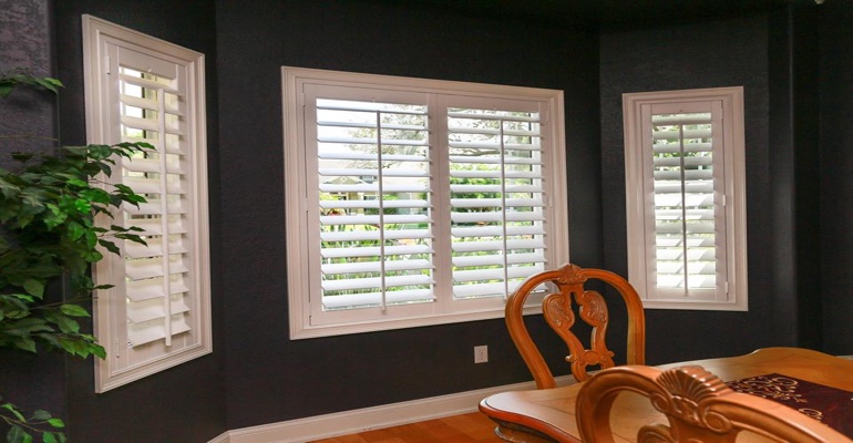 Crisp Plantation Shutters In Dining Room With Dark Paint