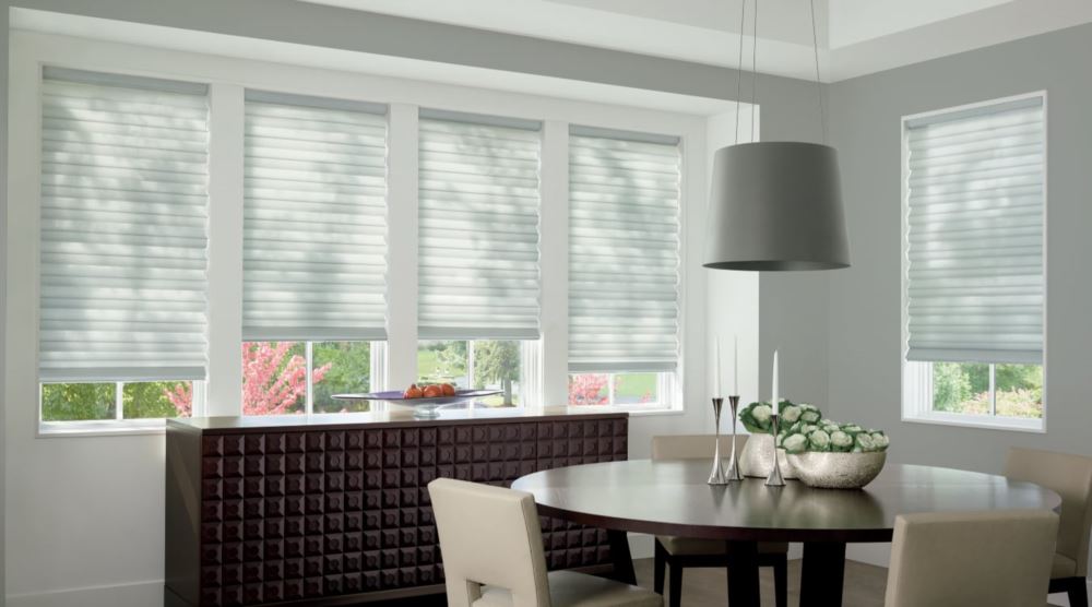 Custom cordless roller shades have a clean look and are appropriate for any room. Cordless motorized shades in a Atlanta dining room