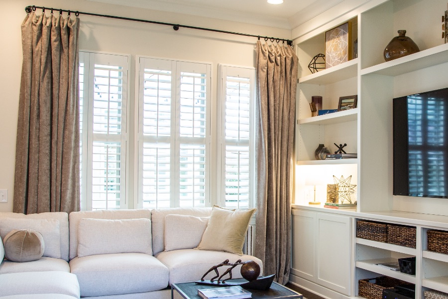 Install sun-resistant Polywood shutters in Atlanta. Shutters in a living room