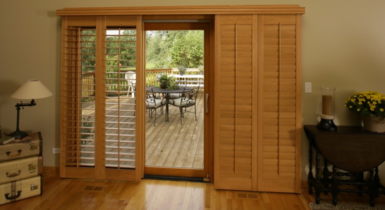 You can even match your wood shutters to your patio. Atlanta wood shutter sliding door