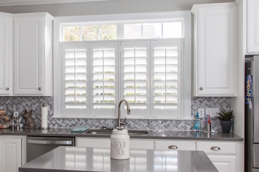 Classic Polywood interior shutters in Atlanta are moisture-resistant. White Polywood shutters above a kitchen sink