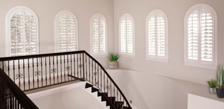 Custom-made window treatments cover your entire window and smoothly open and close. Arched Plantation Shutters