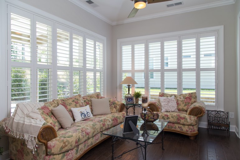 Airy sunroom with plantation shutters in Atlanta.