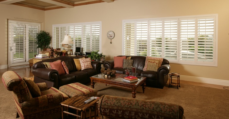 Shutters can let in as much light as you need. Atlanta family room with french door shutters.
