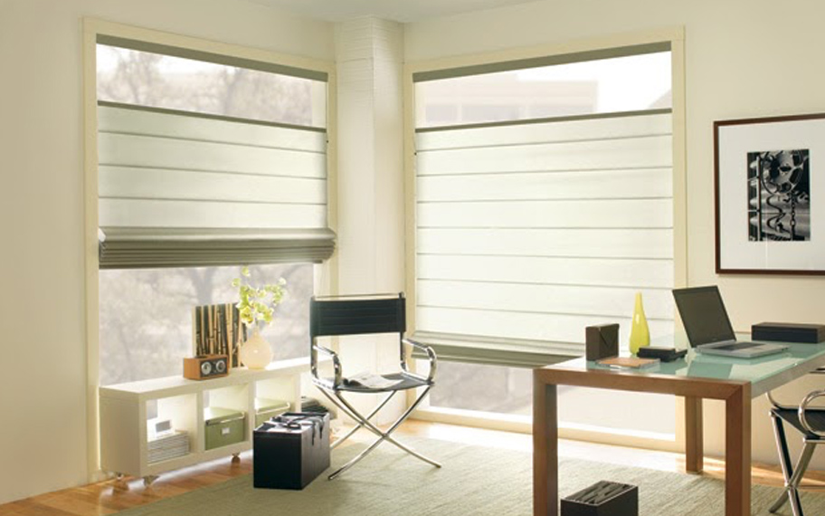 Upgrade your windows with stylish window shades or shutters in Atlanta. Stylish sheer shades in the corner of a modern office.